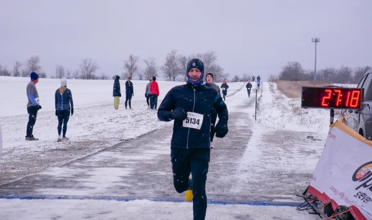 man running in the snow