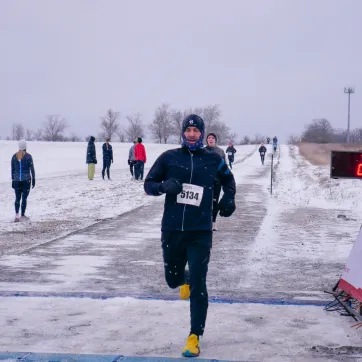 man running in the snow