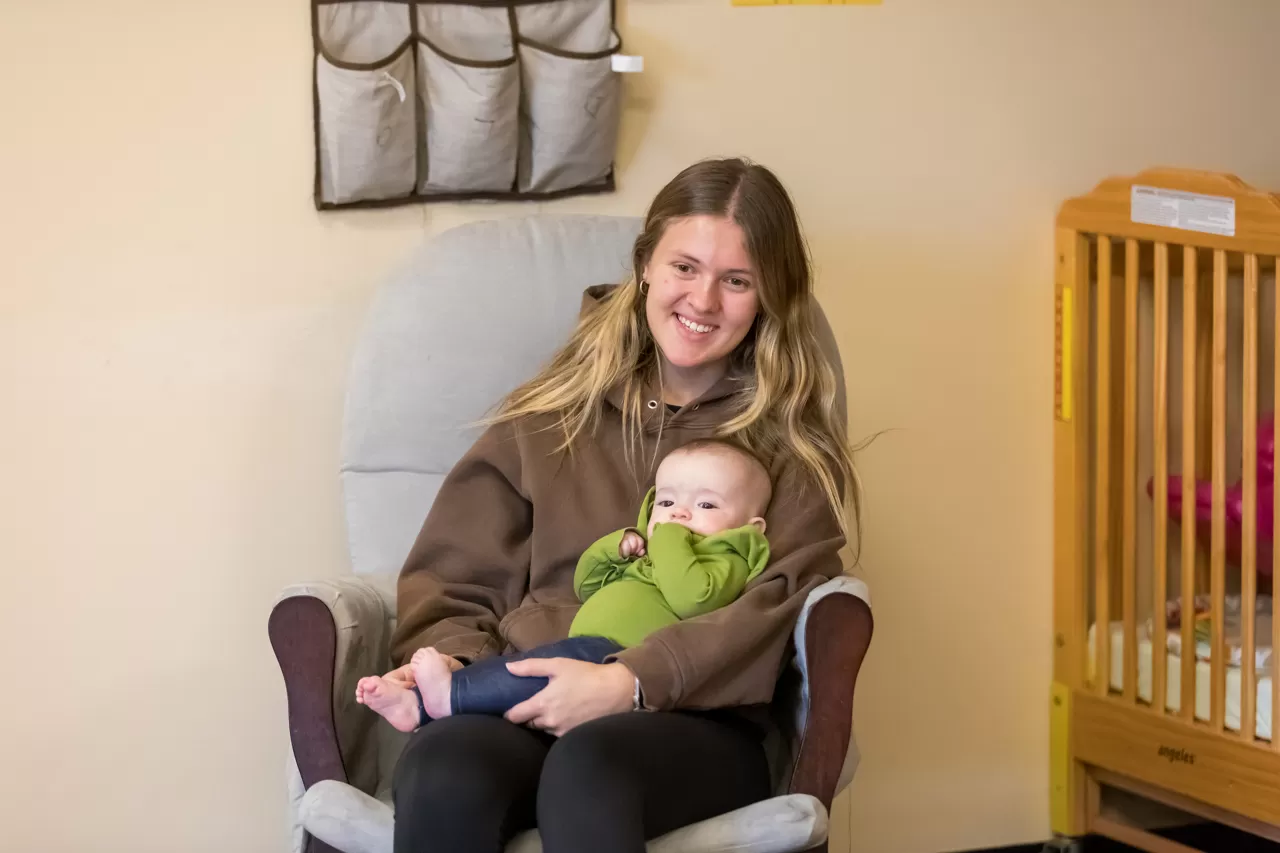 child care leader with infant