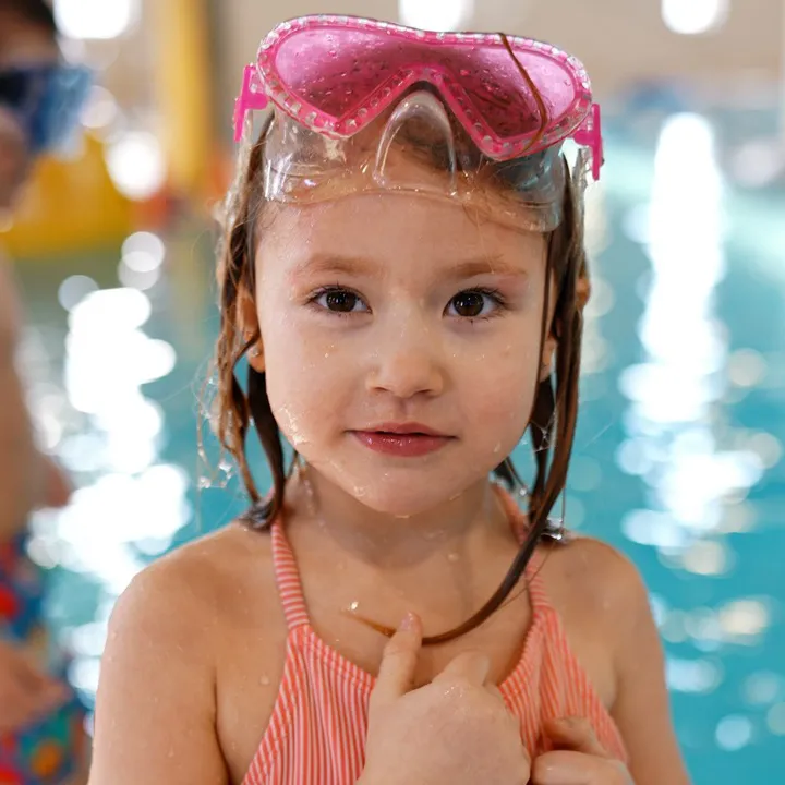 girl wearing goggles at the YMCA pool