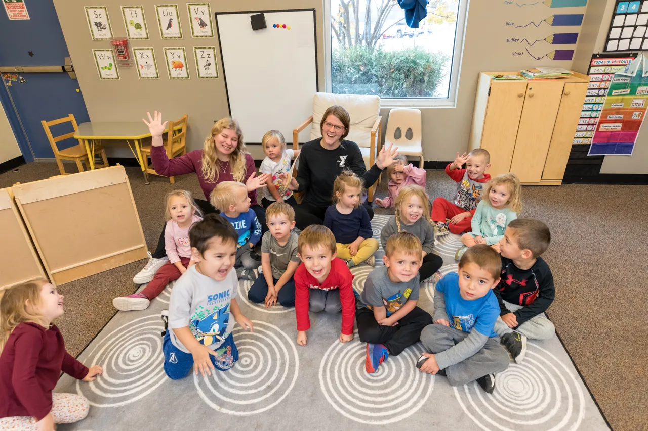 group of preschool children in the YMCA smiling at the camera