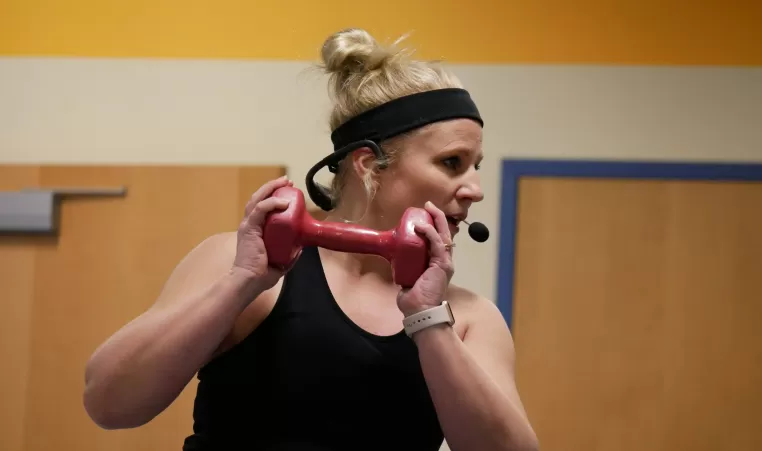 woman holding dumbbell