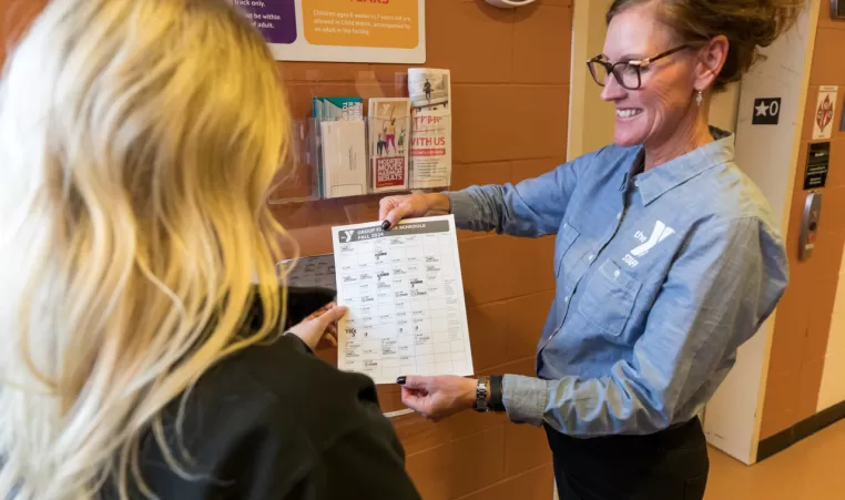 woman displaying a schedule