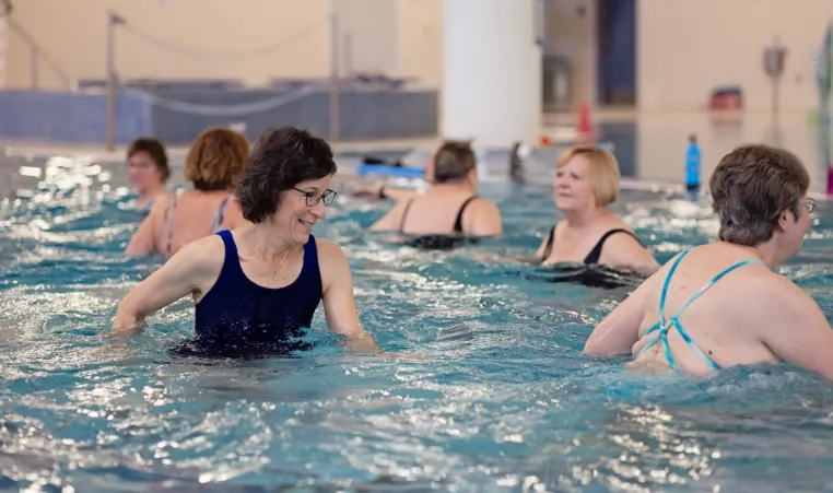 senior women in water aerobics class