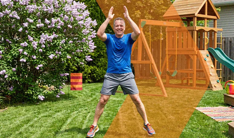 man doing jumping jacks in his backyard