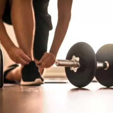 dumbbell and water bottle on the floor