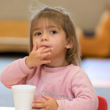 child eating snack at the YMCA