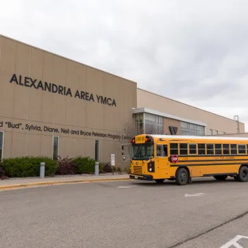 a school bus in the YMCA parking lot