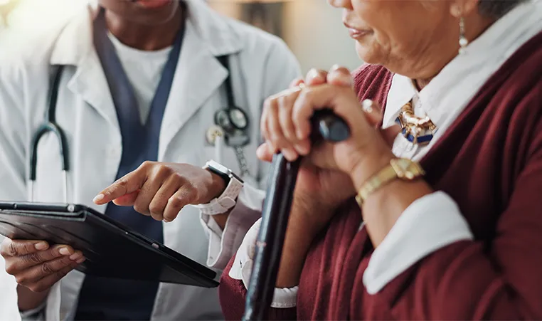 Doctor working with a senior woman