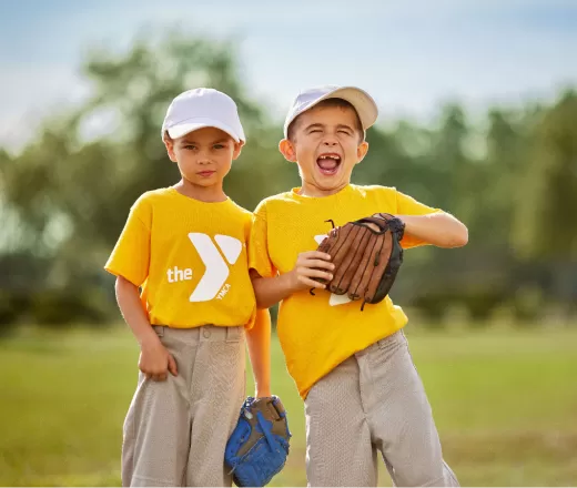 2 happy kids playing t-ball