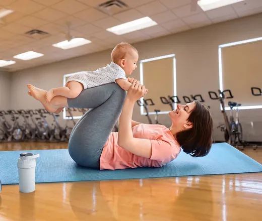 mother and child in postpartum exercise class